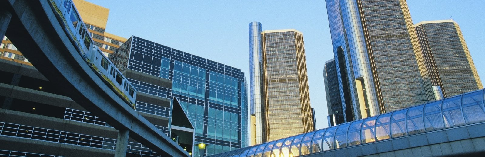 Looking up at several Detroit skyscrapers.