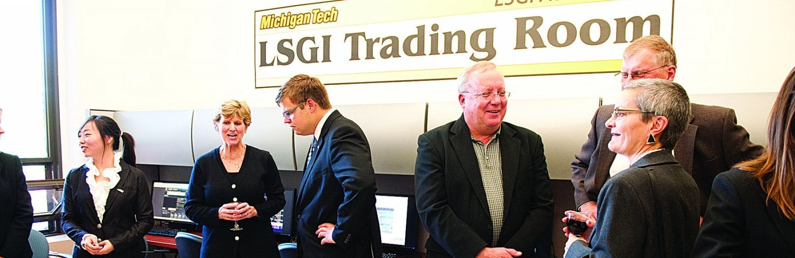 people at the opening of the LSGI Trading Room