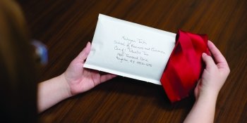 A letter and a red tie.