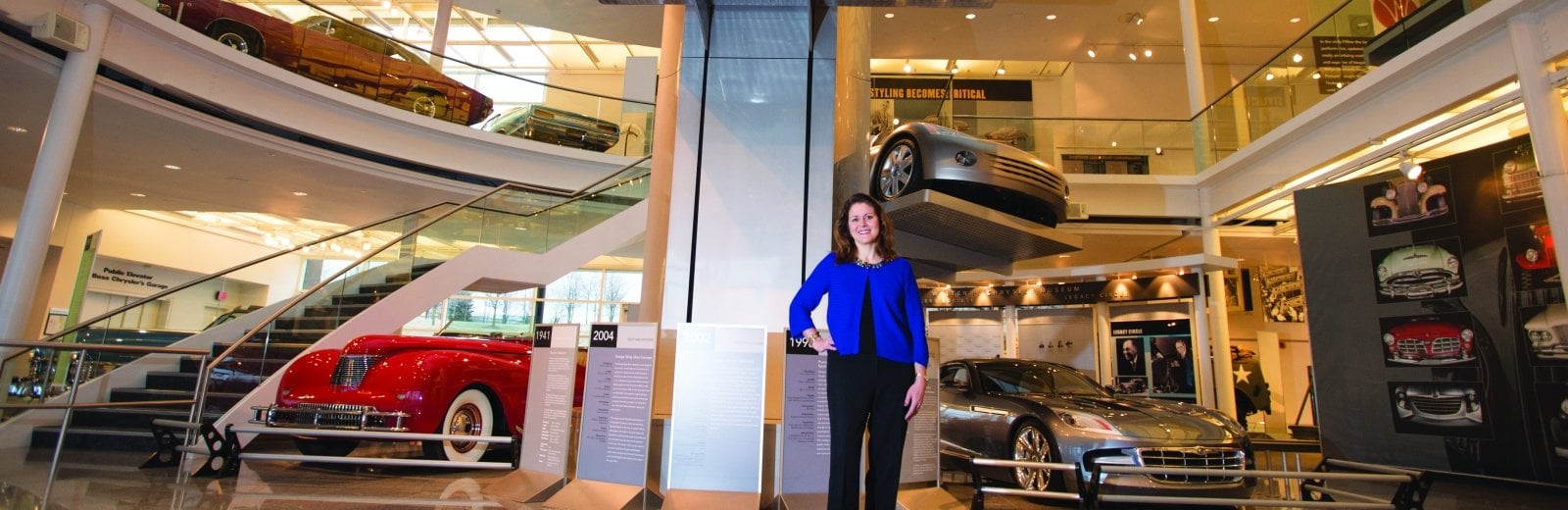 JoAnn Heck in front of cars