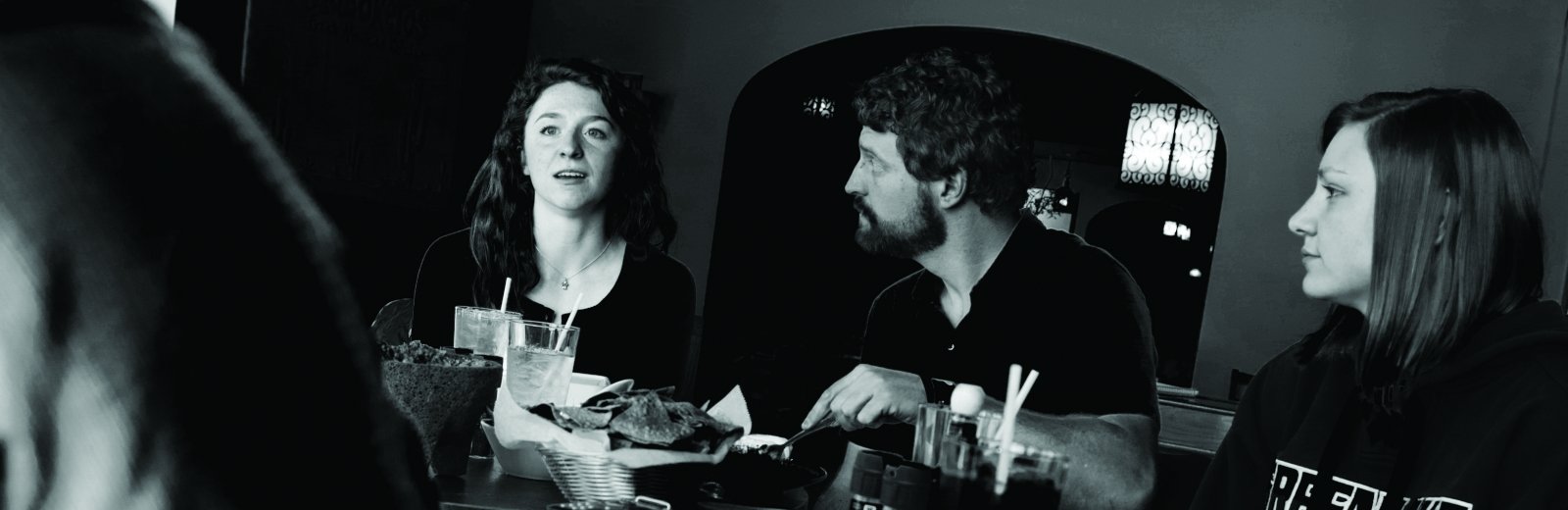 Madeline Haben, Tony Schwenn and Kori Sternik around a table.