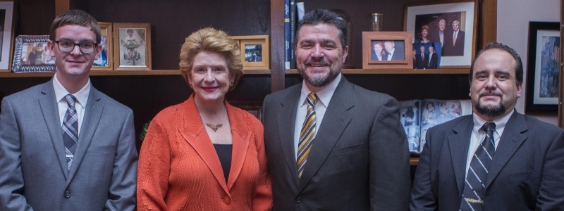 tudent Jerrid Burdue, Debbie Stabenow, Dean Johnson and Emanuel Oliviera posing and smiling