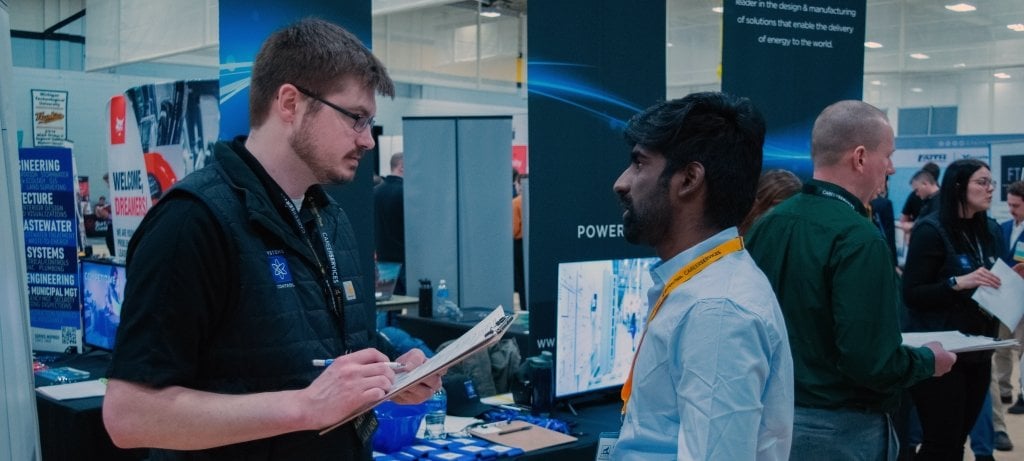 Systems Control recruiter talking to a student at the spring 2024 Career Fair