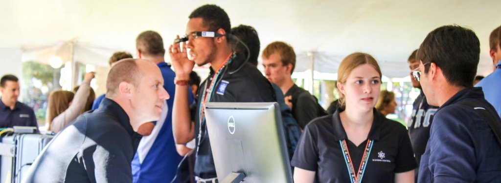 Recruiters chatting with student during CareerFEST