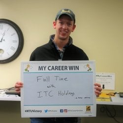Matthew Rudy holding a sign that say "Career Win: Full time with ITC Holdings"