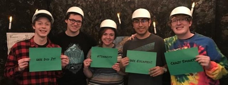 Students, triumphant after beating the escape room
