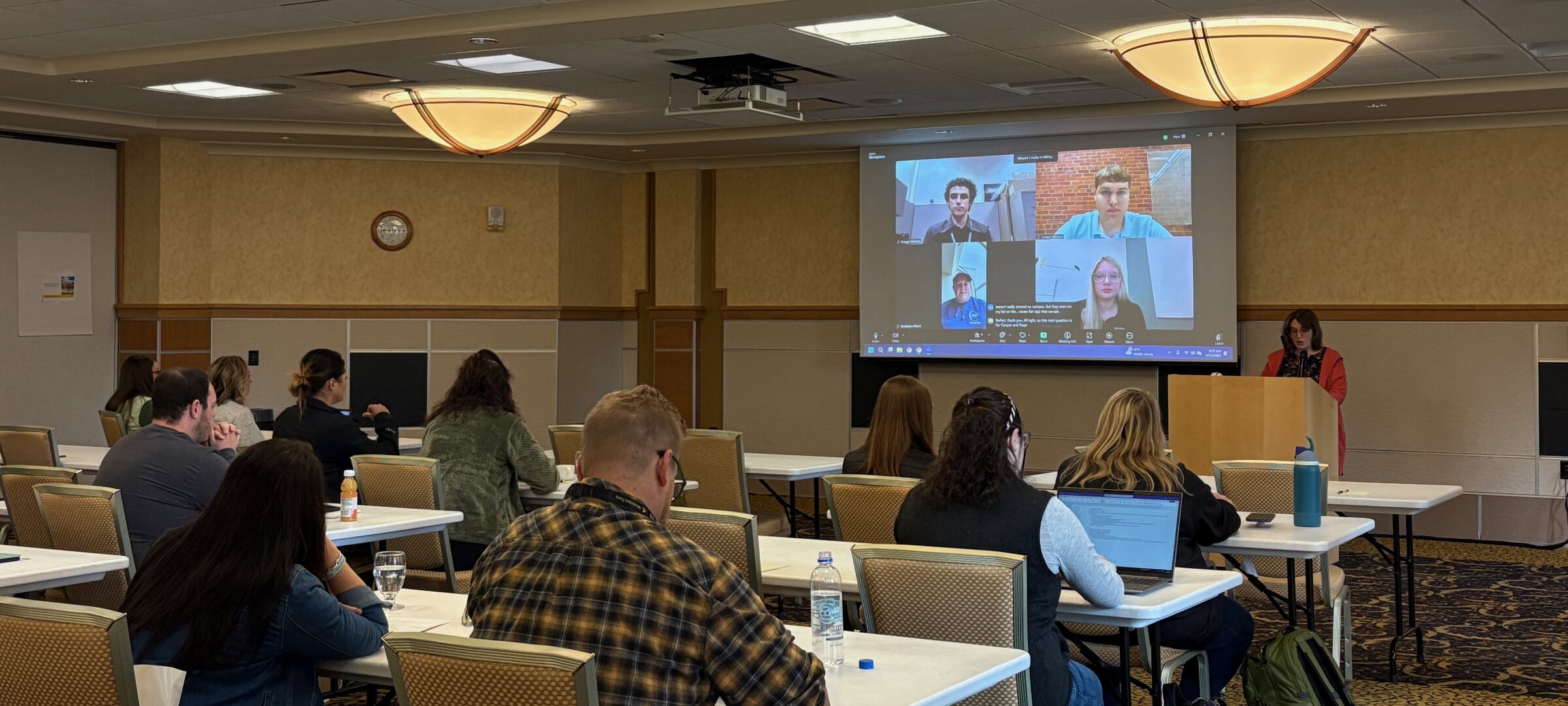 Attendees watching a virtual presentation.