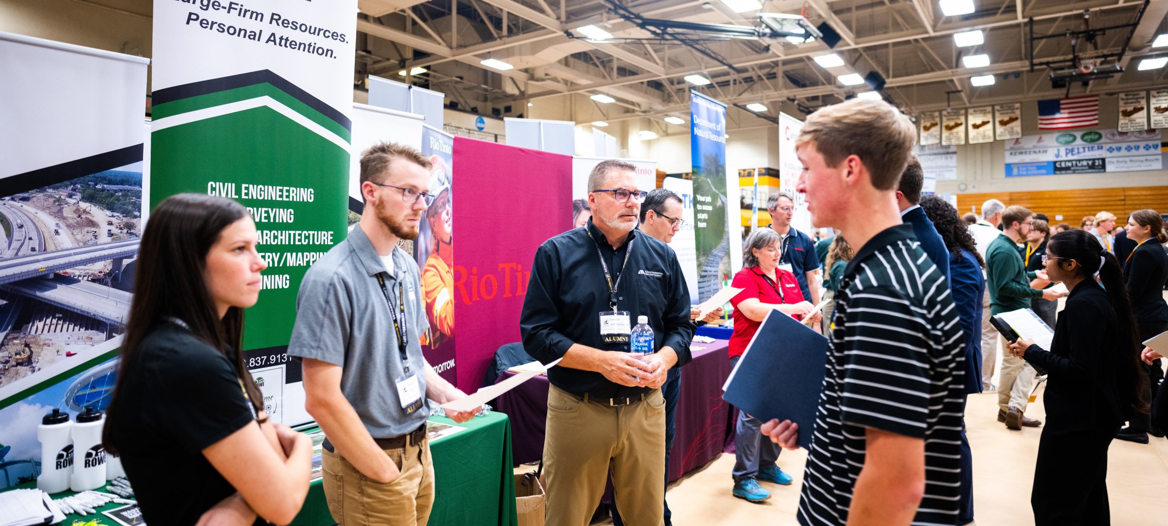 Student interacting with recruiters at Career Fair.