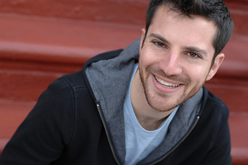 Headshot of man in black canvas jacket
