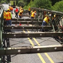 Crew fixing deteriorating trusses.