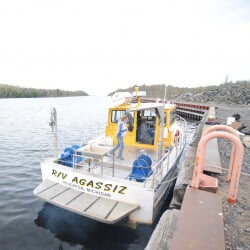 Boat tied to dock