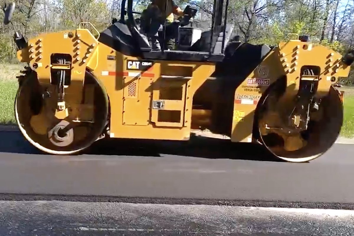 Road roller on pavement.