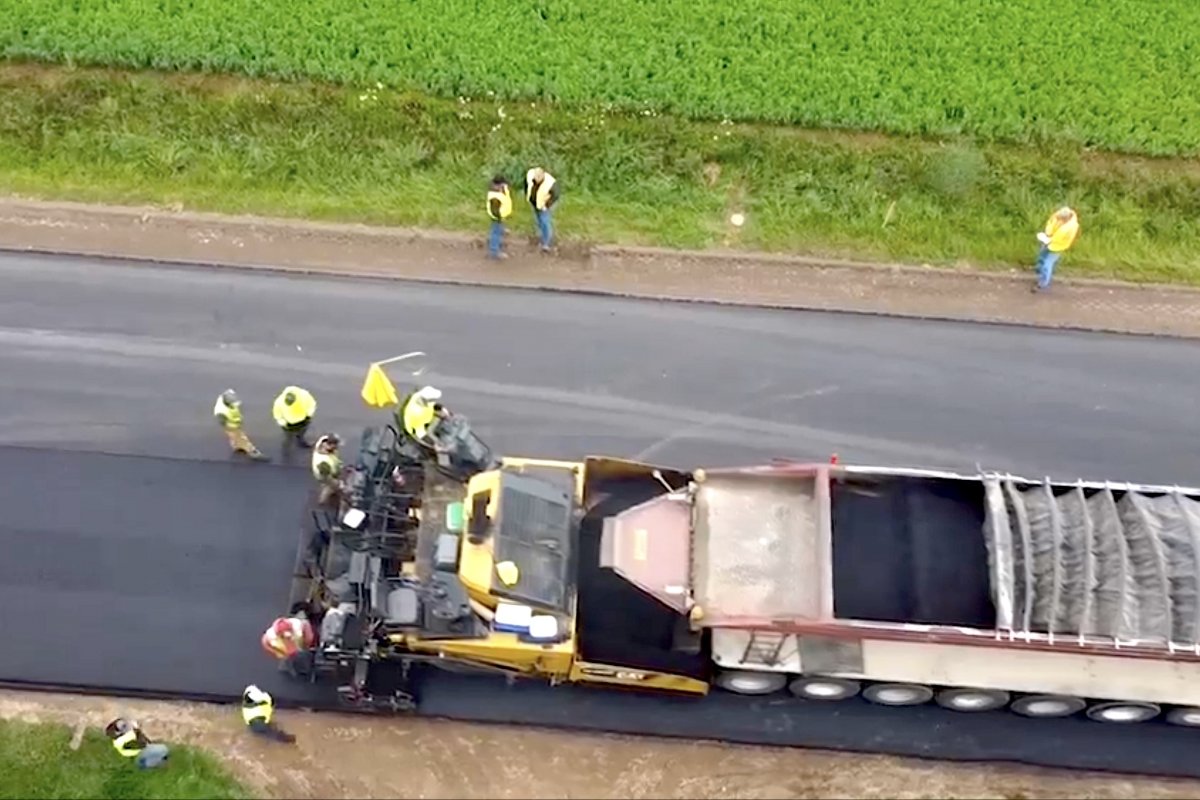Top view of a truck paving a surface layer