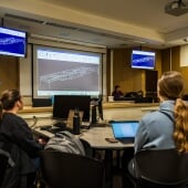 Students in a Steel Bridge planning meeting