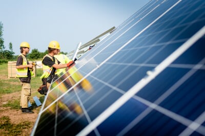 people installing solar panels