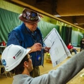 Two people working on a construction management