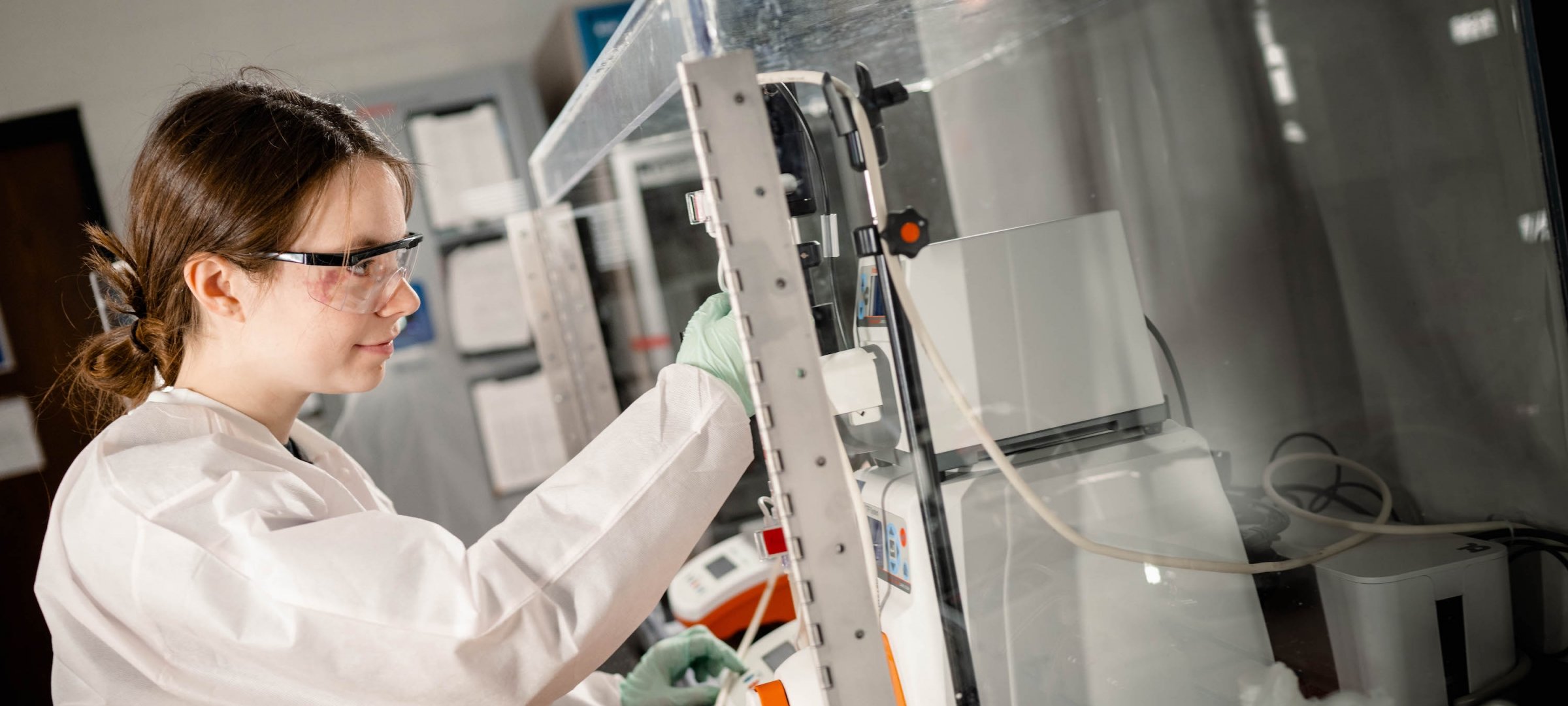 Chemical Engineering graduate work in a lab.