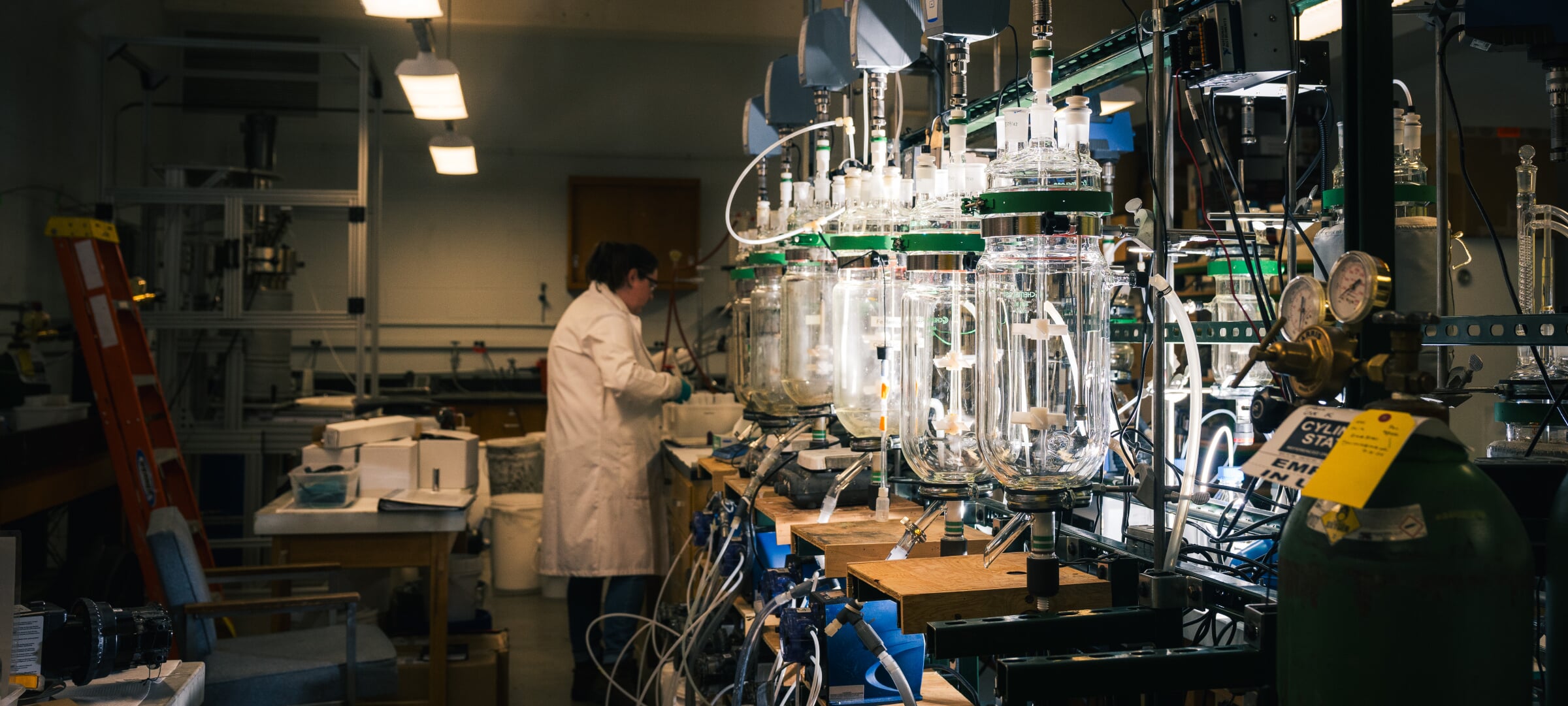 A chemical engineering lab with large containers and tubes