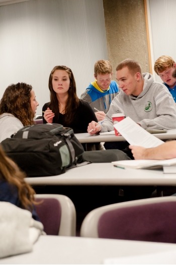 Students interacting in a classroom in the Harold Meese Center