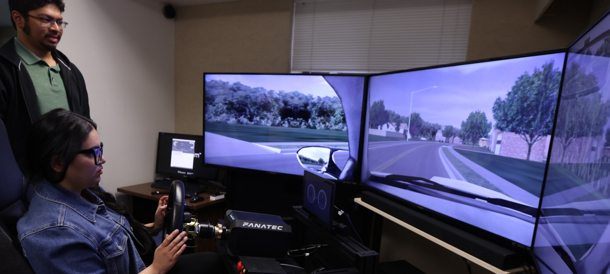 Two students with the driving simulator.