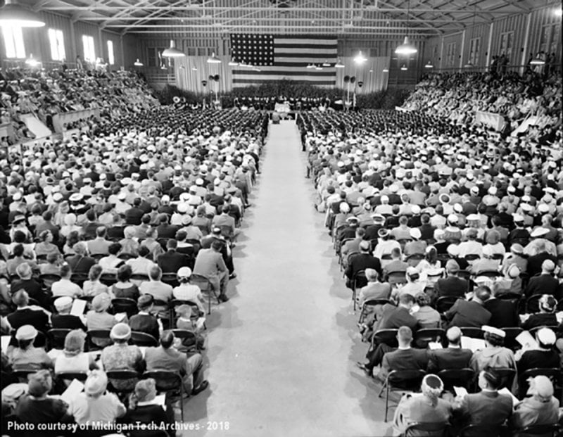 Black and white photo of a commencement ceremony inside the Dee Stadium in 1958