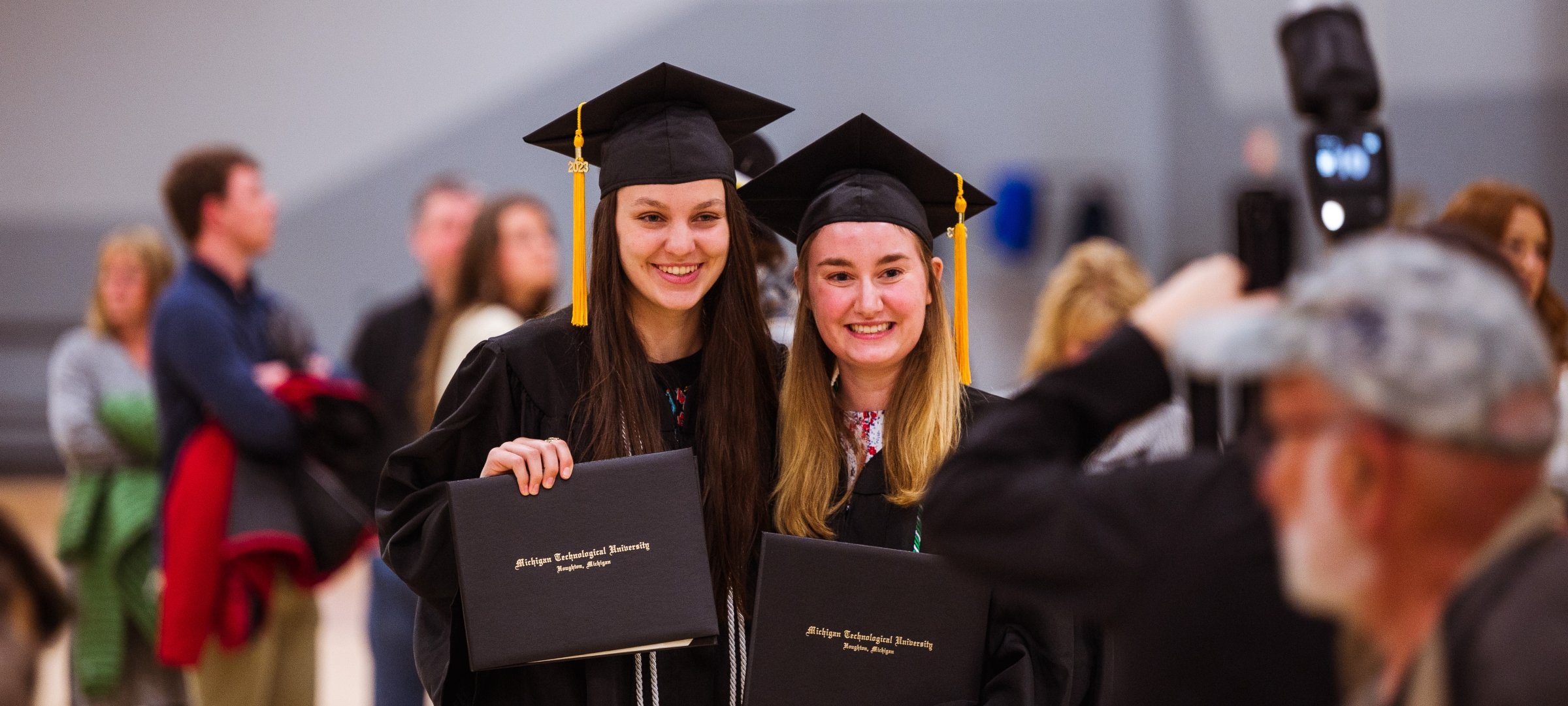 Undergraduate students in the wood gym at commencement.