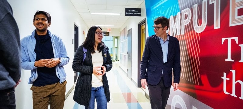 Dean Dennis Livesay talks with a student in Rekhi Hall