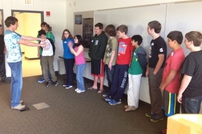 Charles Wallace and students participate in a Copper Country Coders activity