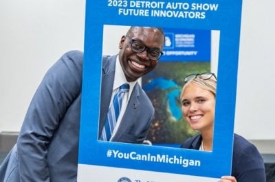 Michigan Lt. Governor Garlin Gilchrist II (left) with Michigan Tech student Emily Roth, Electrical Engineering BS, at the North American International Detroit Auto Show on September 14, 2023