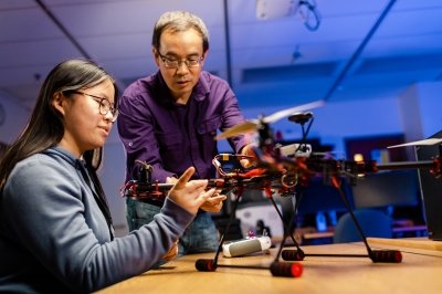 Yu Cai, professor, Department of Applied Computing (right), with Mia Kelley '24, BS in Computer Science senior a minor in cybersecurity