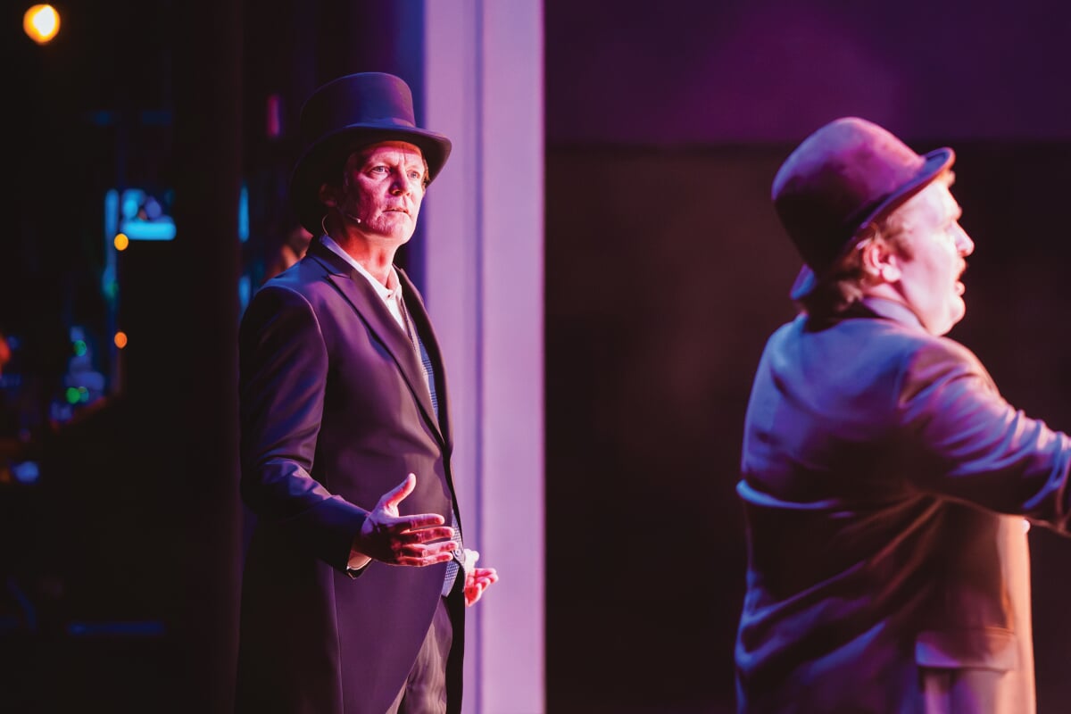 Charles Wallace on stage as the Judge.