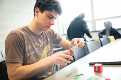 Student using a handheld keycutter.