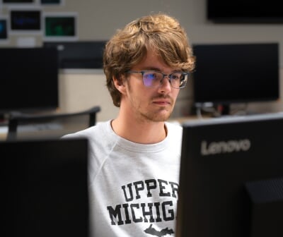 David Reeves sitting at a computer.