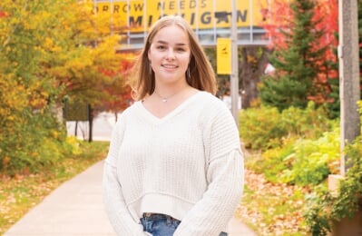 Elise Buzzell standing outside.