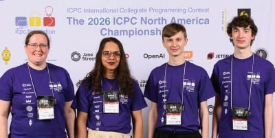 Four MTU Purple team members wearing purple shirts at the 2026 ICPC NAC.