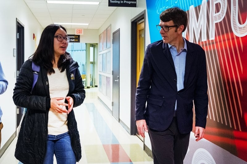 Dean Livesay and a student talk in Rekhi Hall