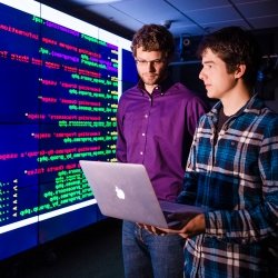 Male students and projection of computer screen