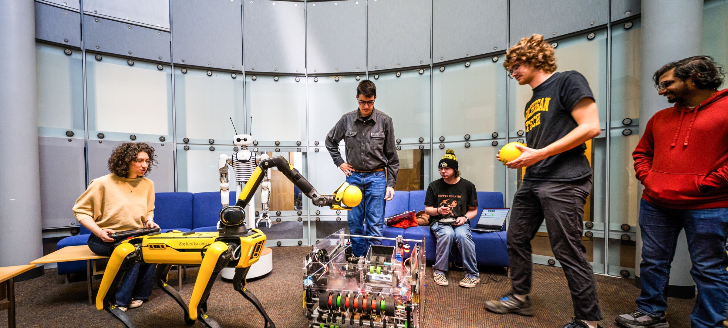 Students working with robotics and AI