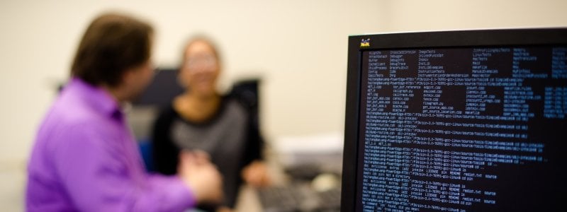 Two students in a research lab