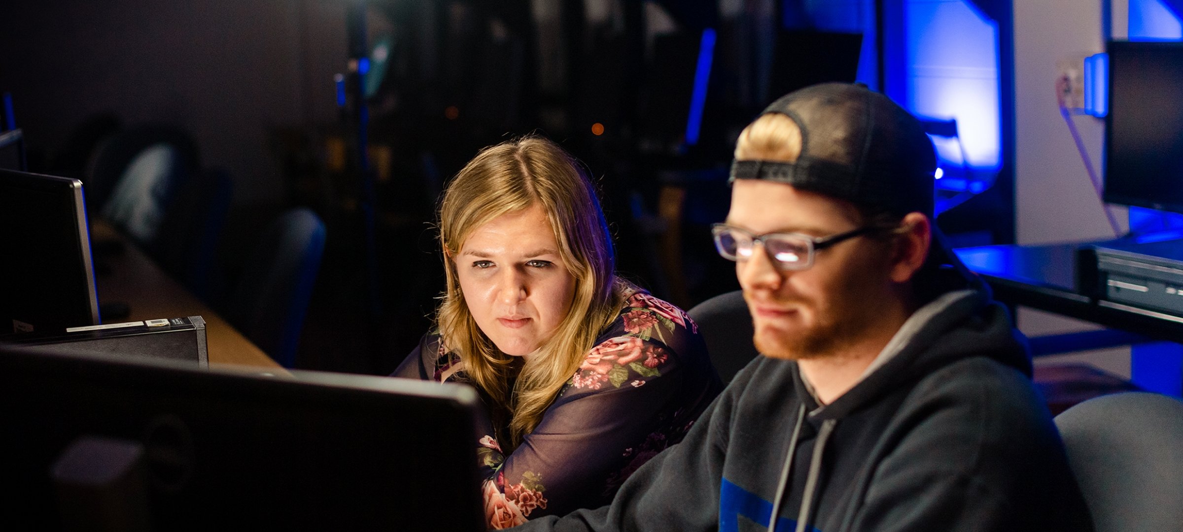 Cybersecurity students work on a lesson in the lab