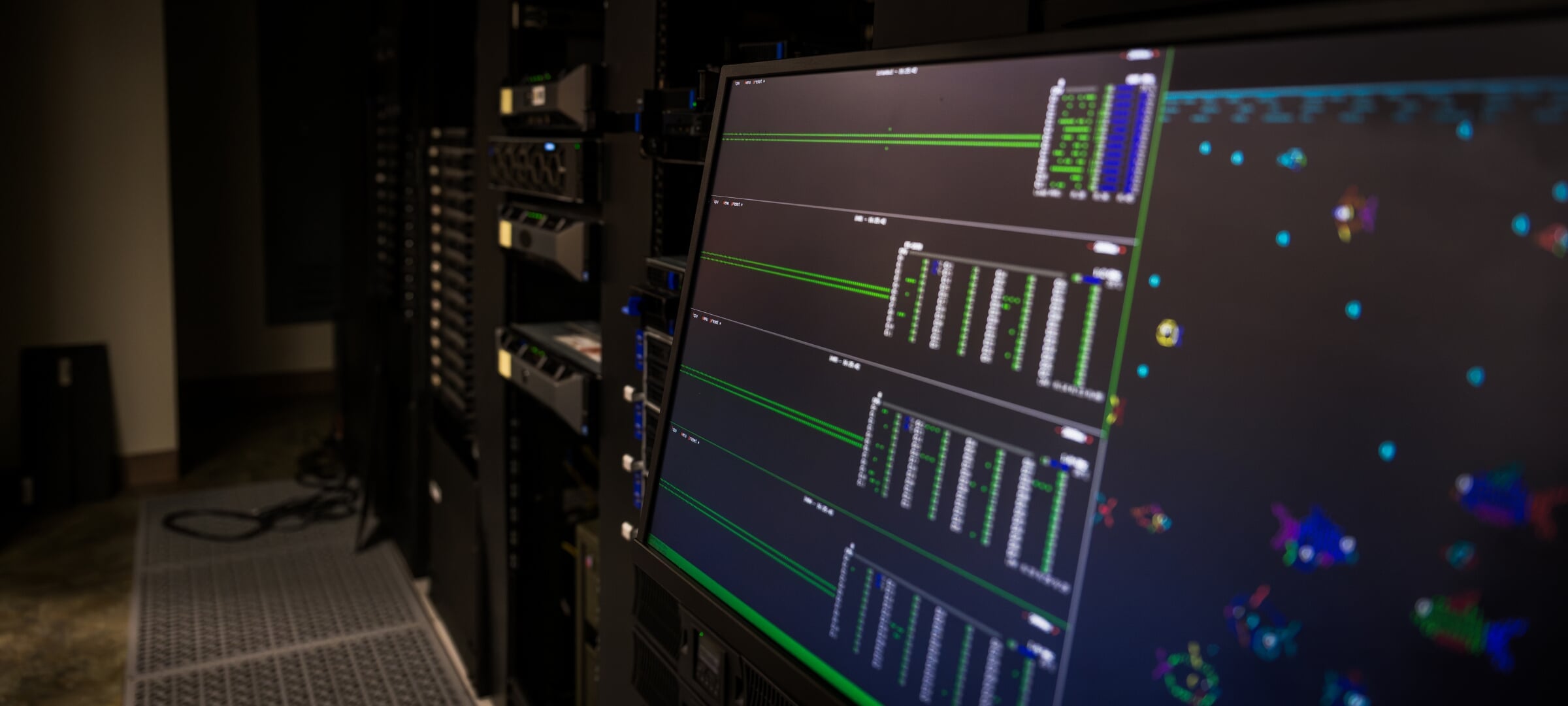 A computer in a server room showing data