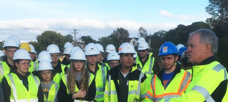 Students in hard hats.