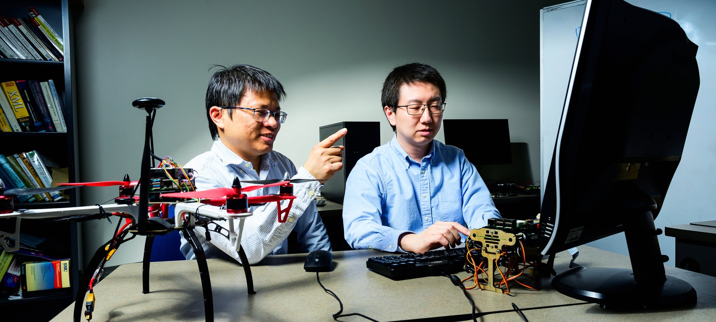 Prof Bo Chen (left) and Niusen Chen '24 PhD in Computer Science