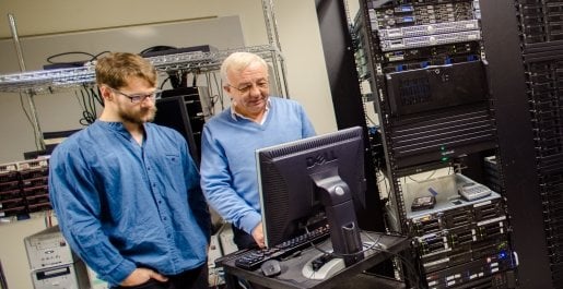 Faculty and student in computer server room