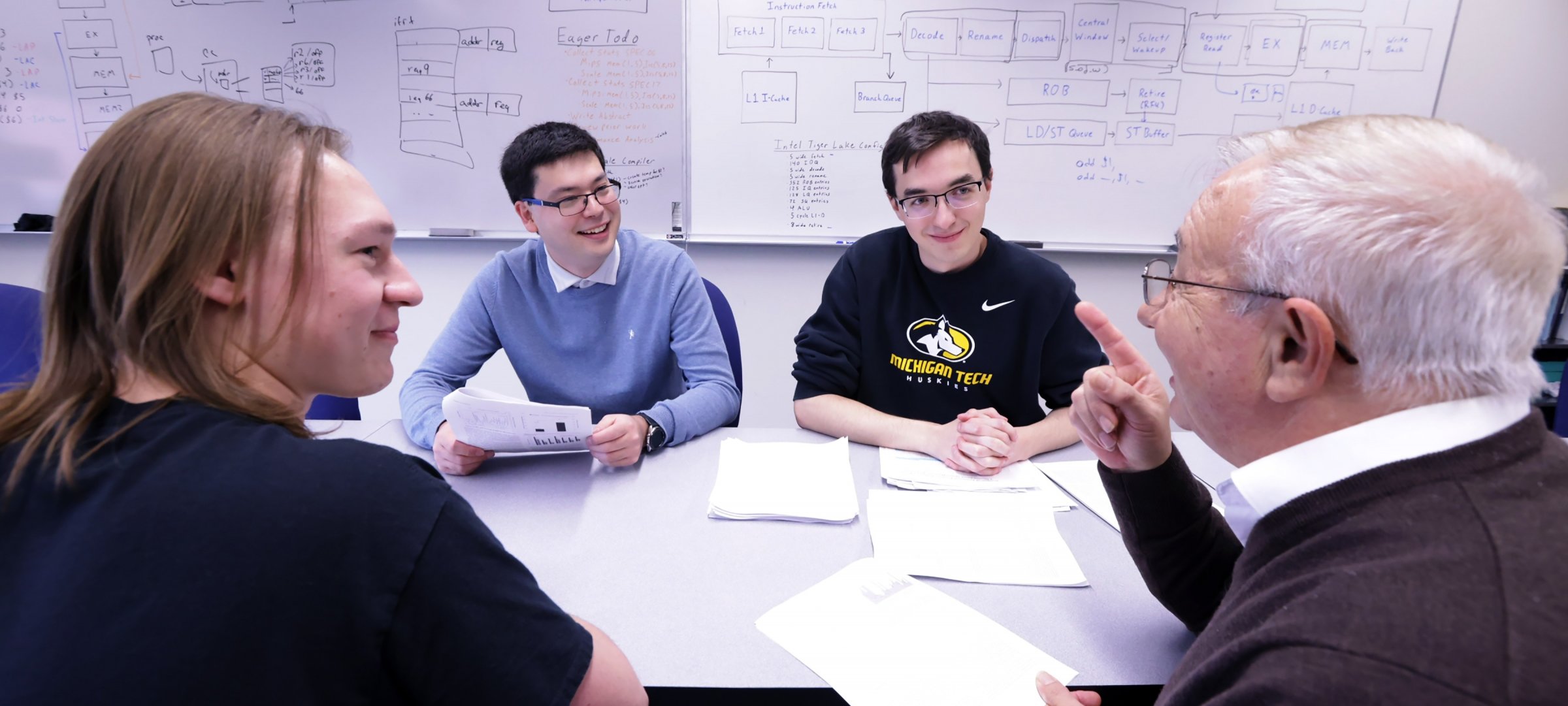 Computing professor and students discuss their work