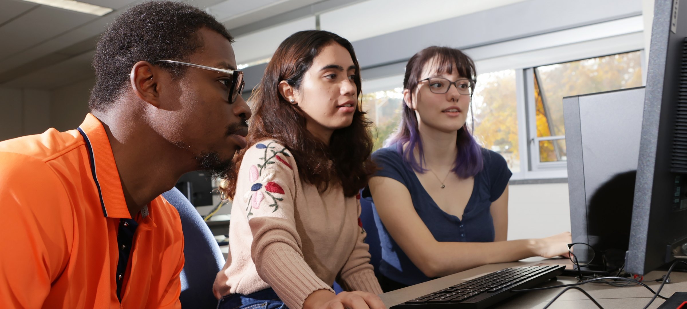 Michigan Tech Computing students share a computer
