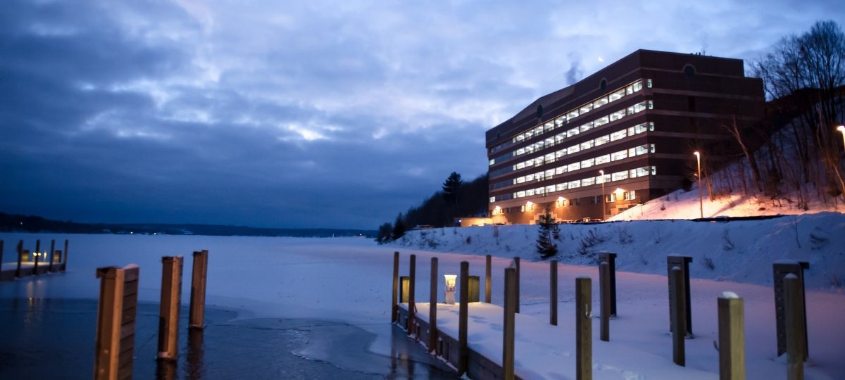 A view of the Minerals and Materials building from the Great Lakes Research Center dock at night.