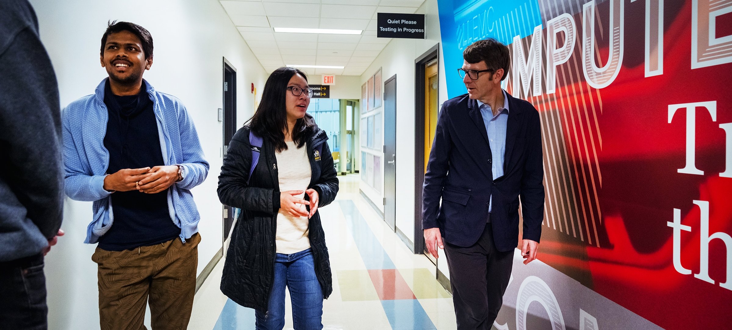 Dean Dennis Livesay talks with students in Rekhi Hall