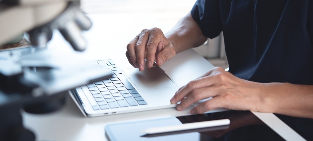 Hands on a laptop keyboard