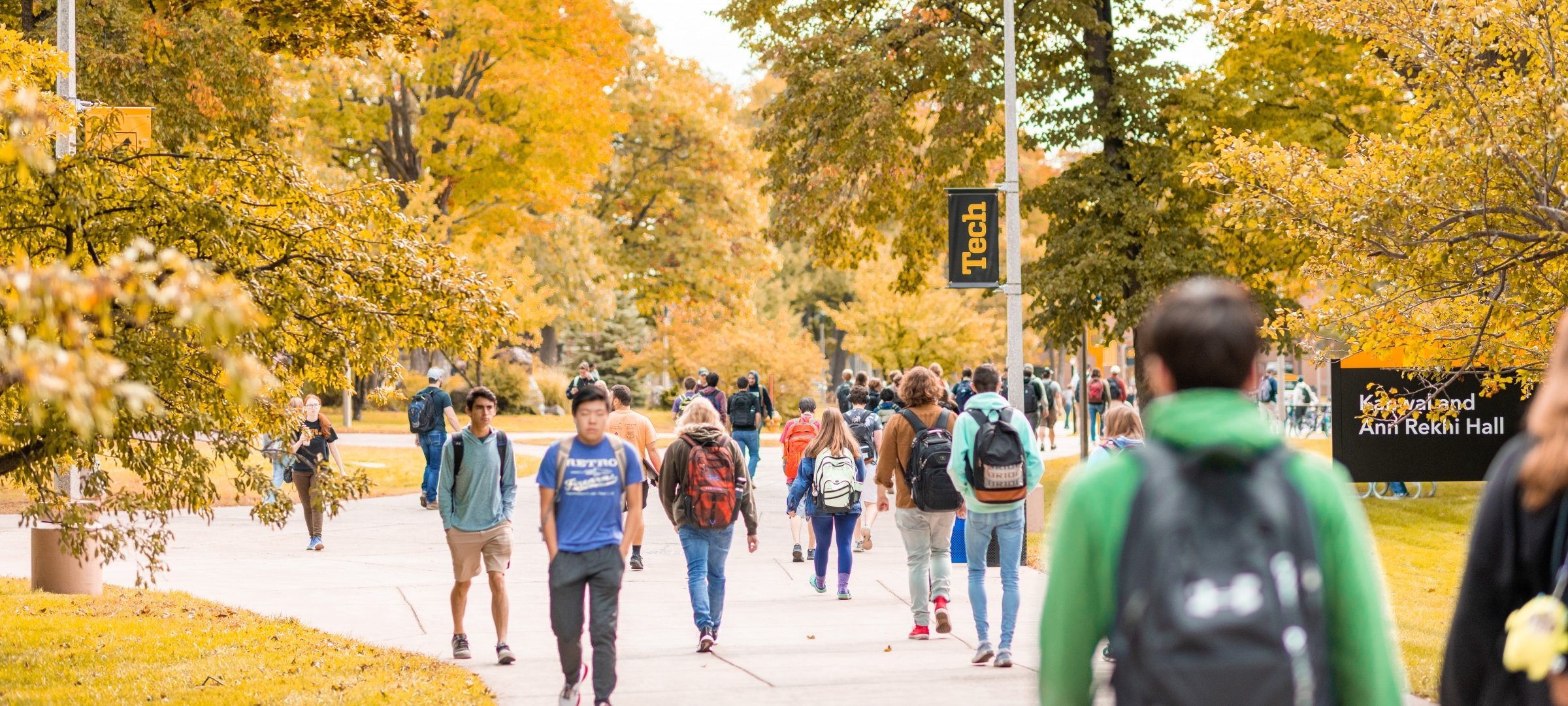 Fall campus mall and students walking to class.